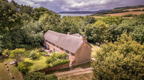 An aerial view of St Gabriel's Cottages and their shared garden, Dorset